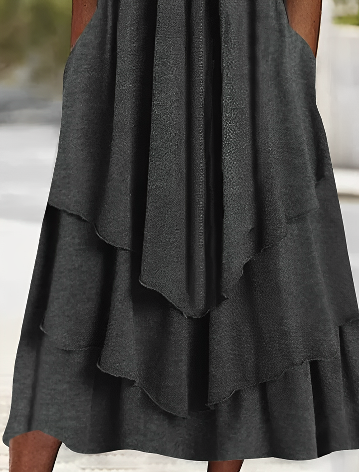 Robe midi cascade charbon – taille empire, manches longues, jupe à volants fluides
