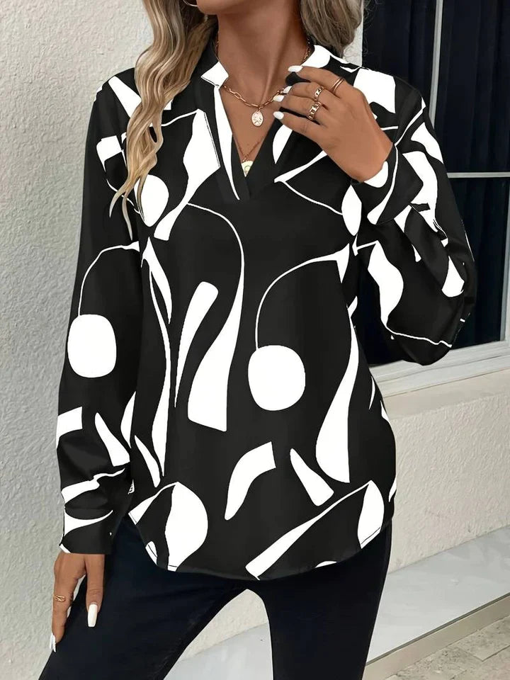 Elegante camicetta da donna con motivo astratto moderno e scollo a V