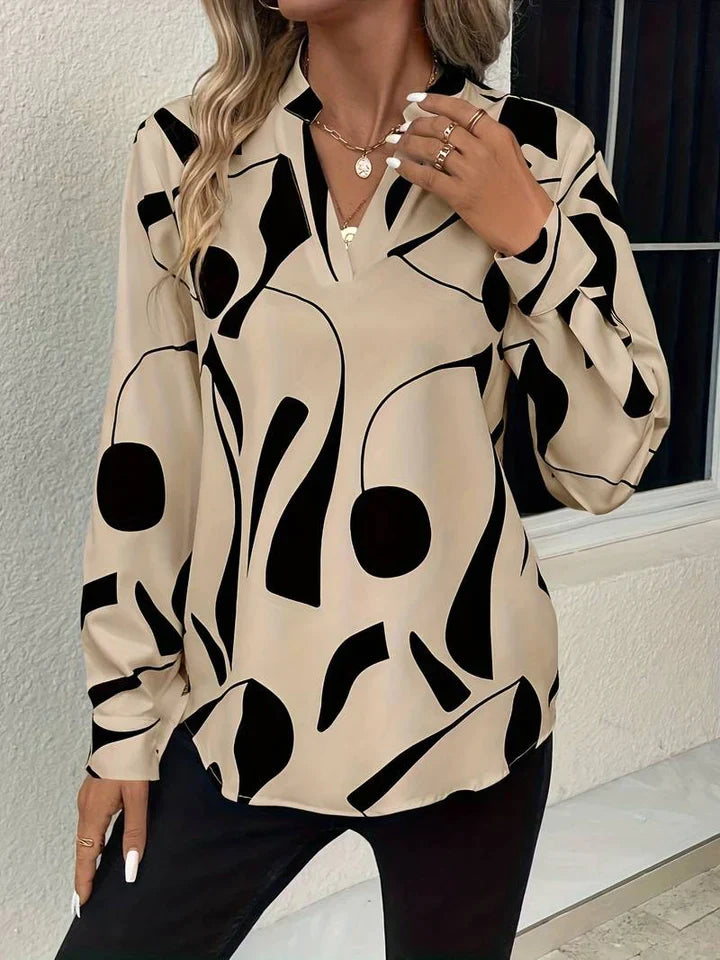 Elegante camicetta da donna con motivo astratto moderno e scollo a V