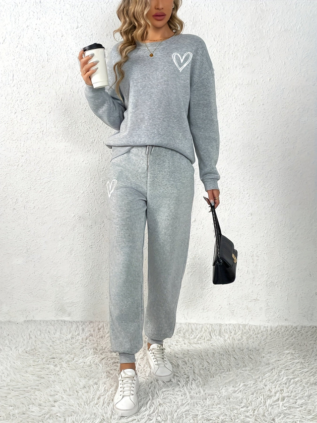 Maglione elegante con scollo rotondo e motivo a cuore & pantaloni da jogging per donna | Ideale per autunno/inverno
