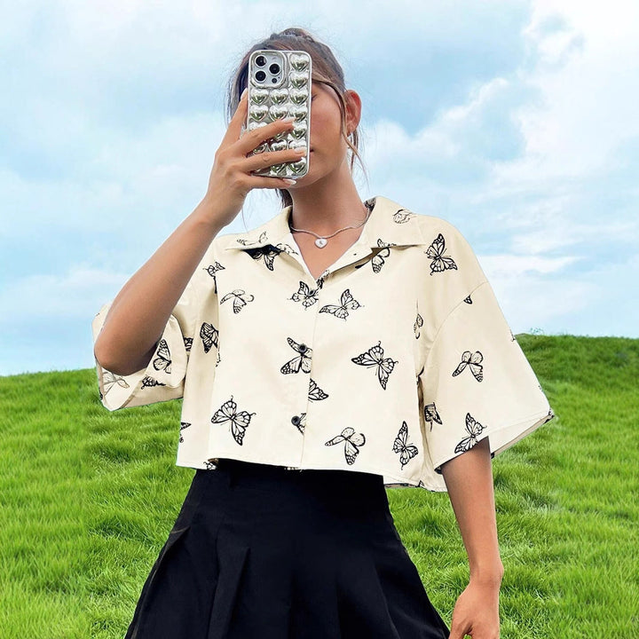 Women's short-sleeve blouse with modern butterfly pattern