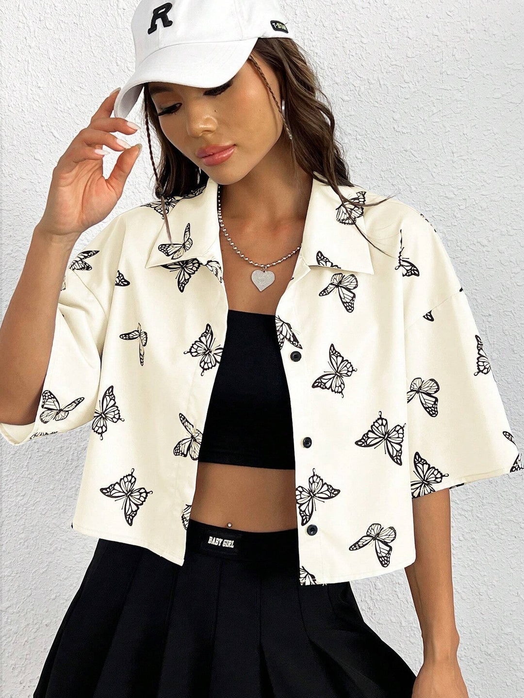 Women's short-sleeve blouse with modern butterfly pattern