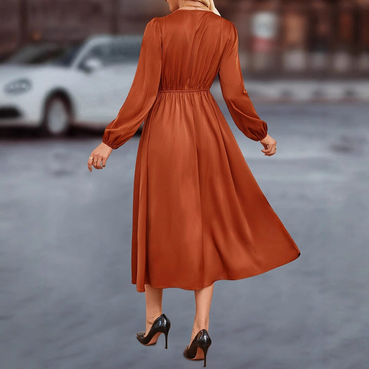 Abito midi da donna con eleganti dettagli a bottoni e rifiniture raffinate sulle maniche