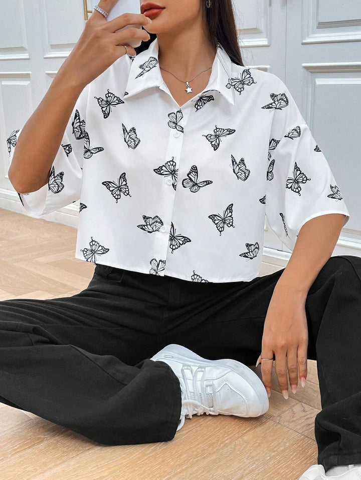Women's short-sleeve blouse with modern butterfly pattern