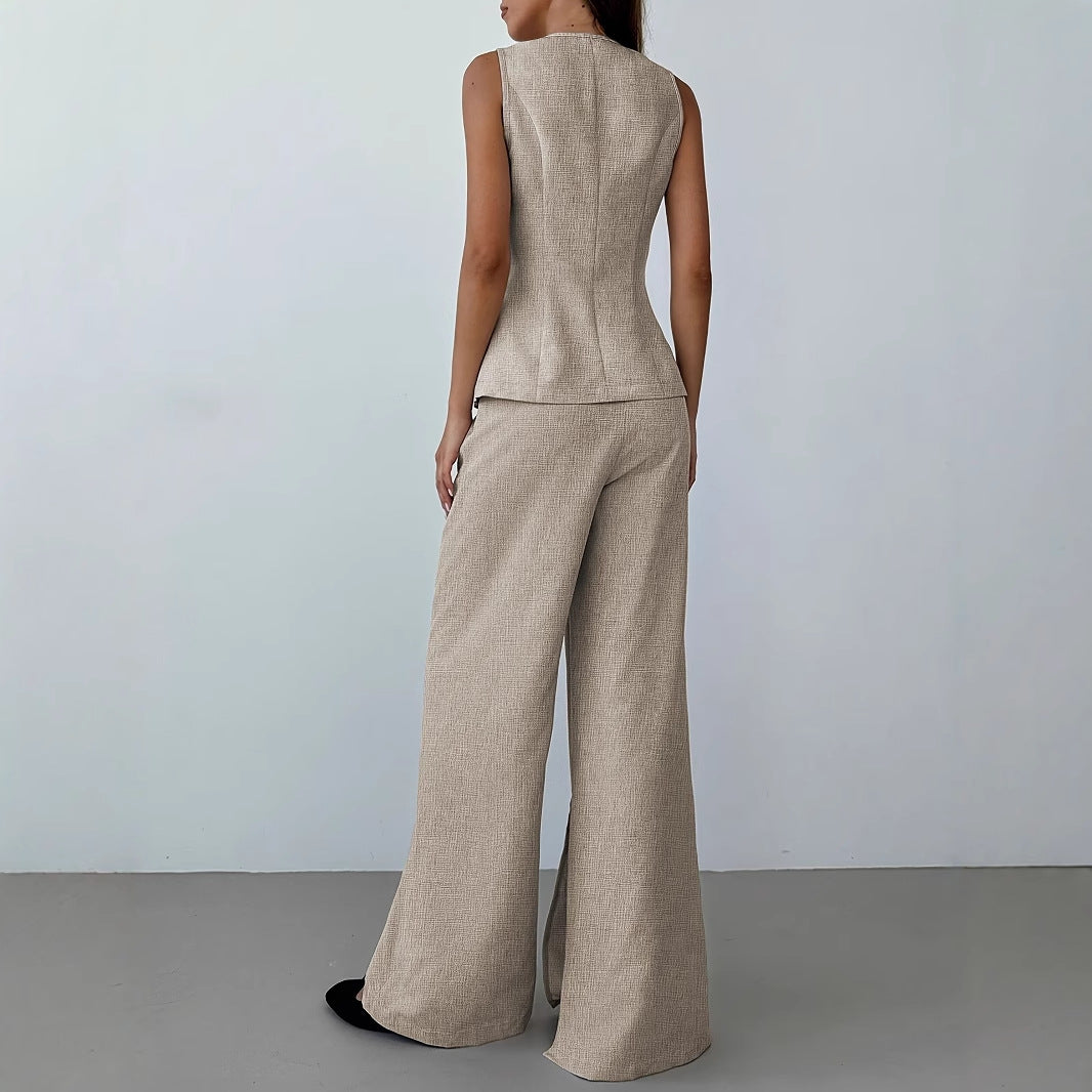 Ensemble elegante da donna composto da blazer senza maniche e pantaloni ampi