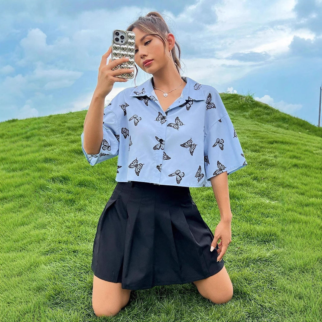 Women's short-sleeve blouse with modern butterfly pattern