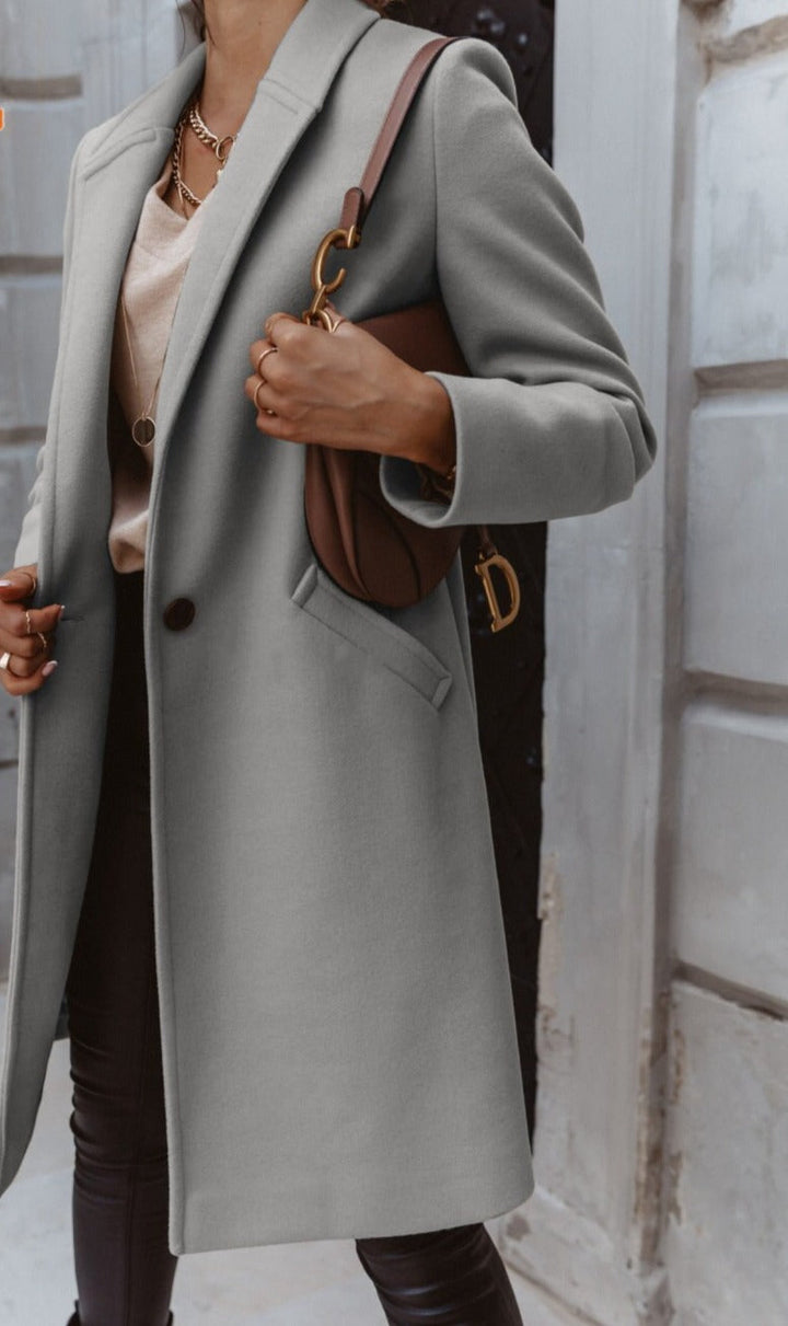 Cappotto lungo con rever e bottone