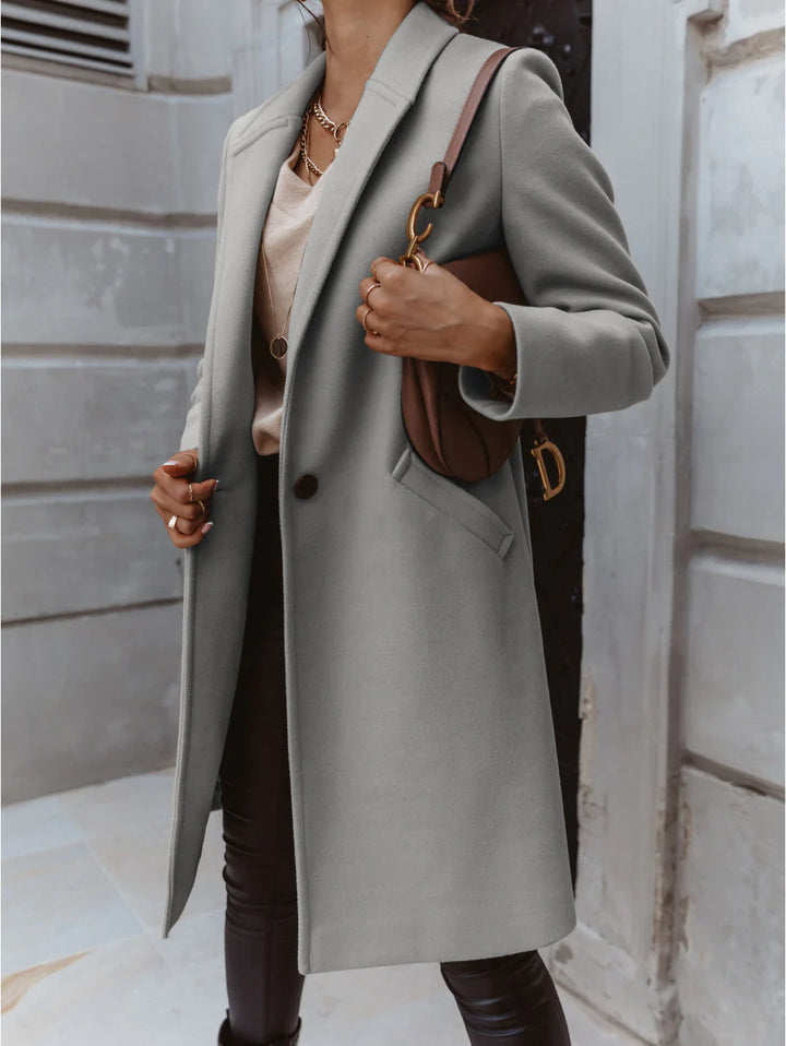 Cappotto lungo con rever e bottone