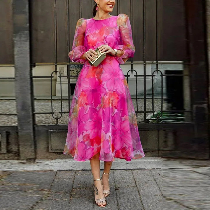 Elegante abito midi con trasparenza floreale e maniche lunghe