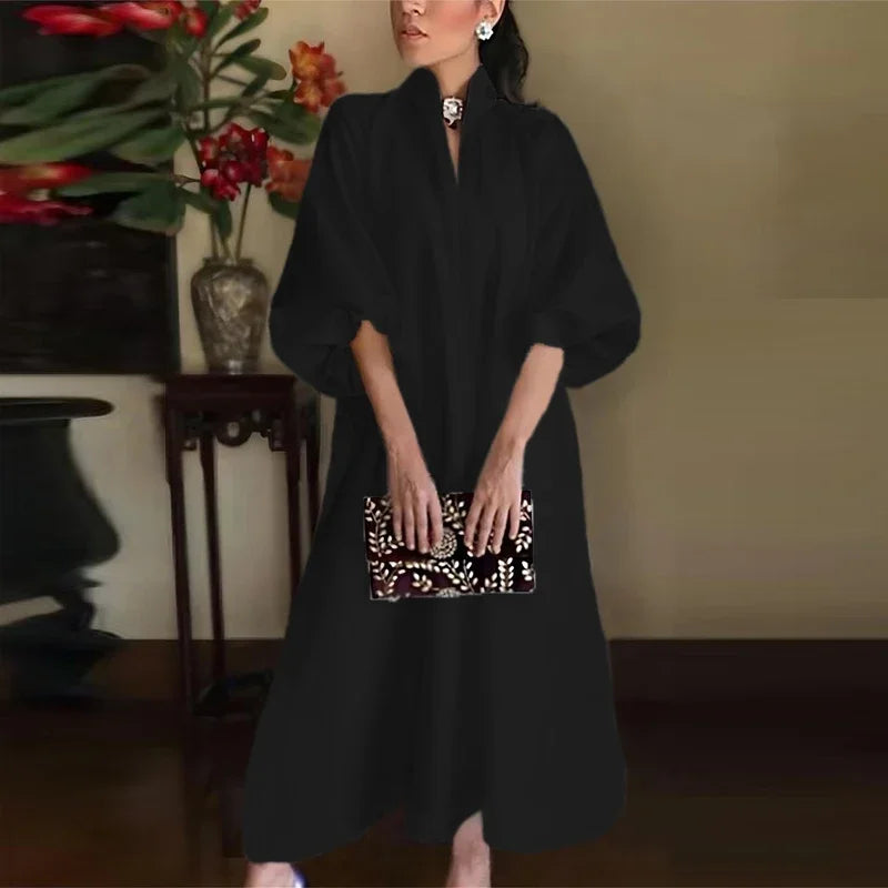 Elegancka sukienka midi z bufiastymi rękawami i stójką – minimalistyczna i szykowna
