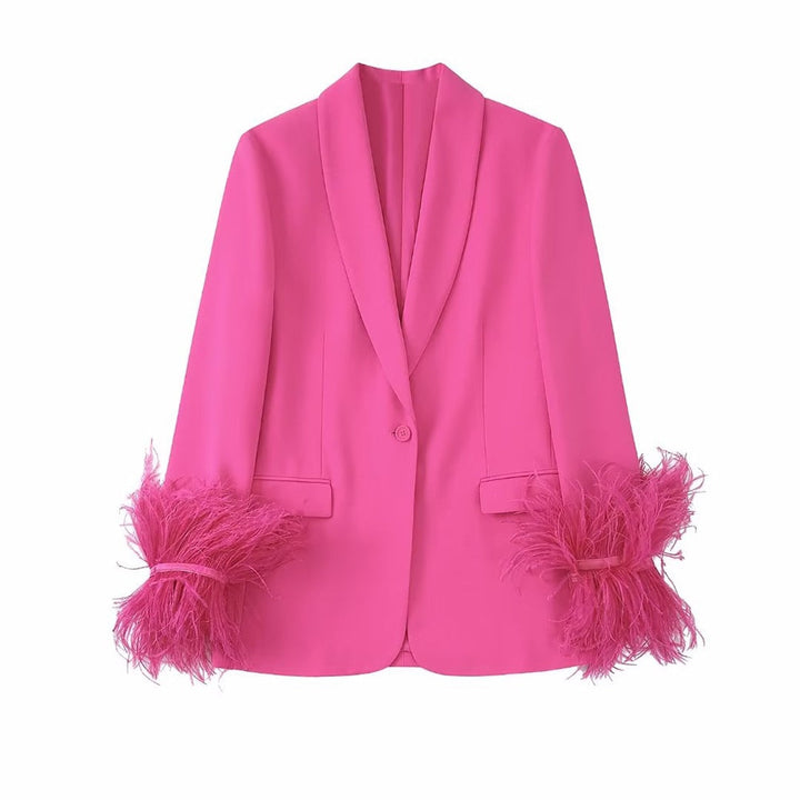 Abito rosa con piume
