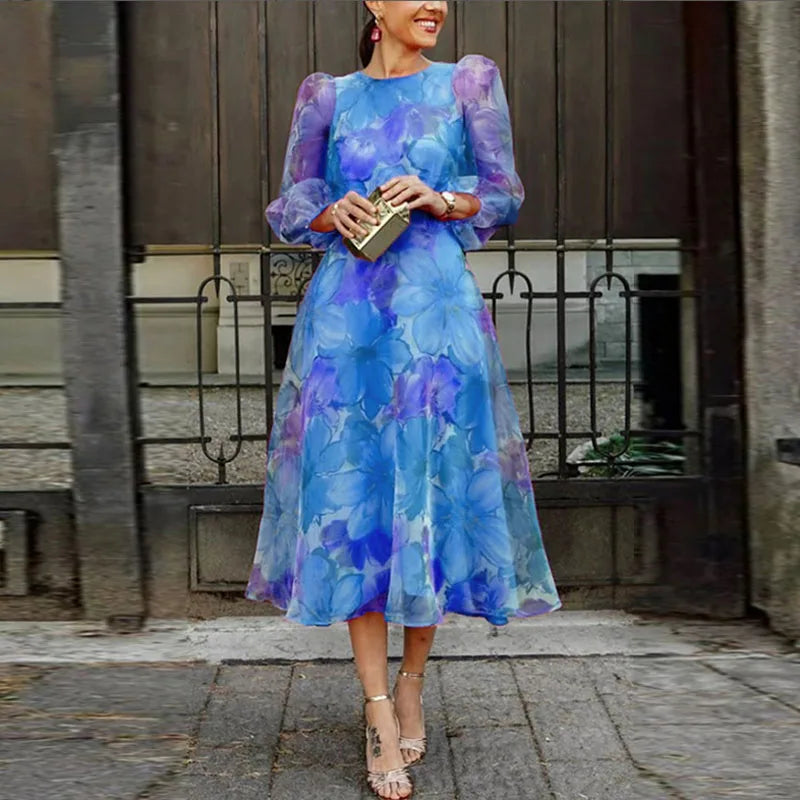 Elegante abito midi con trasparenza floreale e maniche lunghe