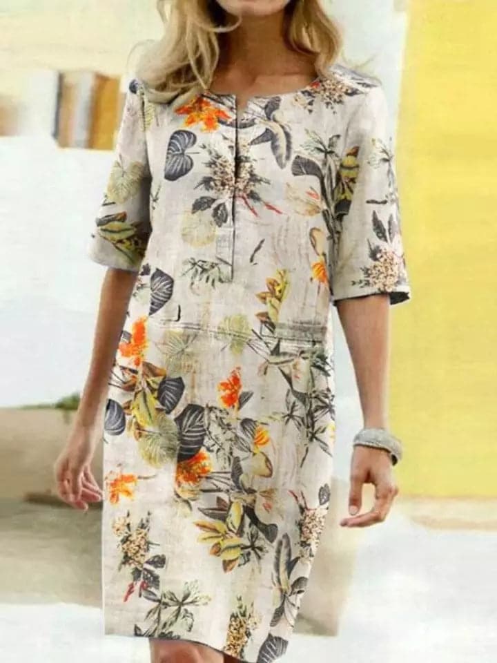 Robe midi botanique vibrante – coupe confortable, manches mi-longues, décolleté rond