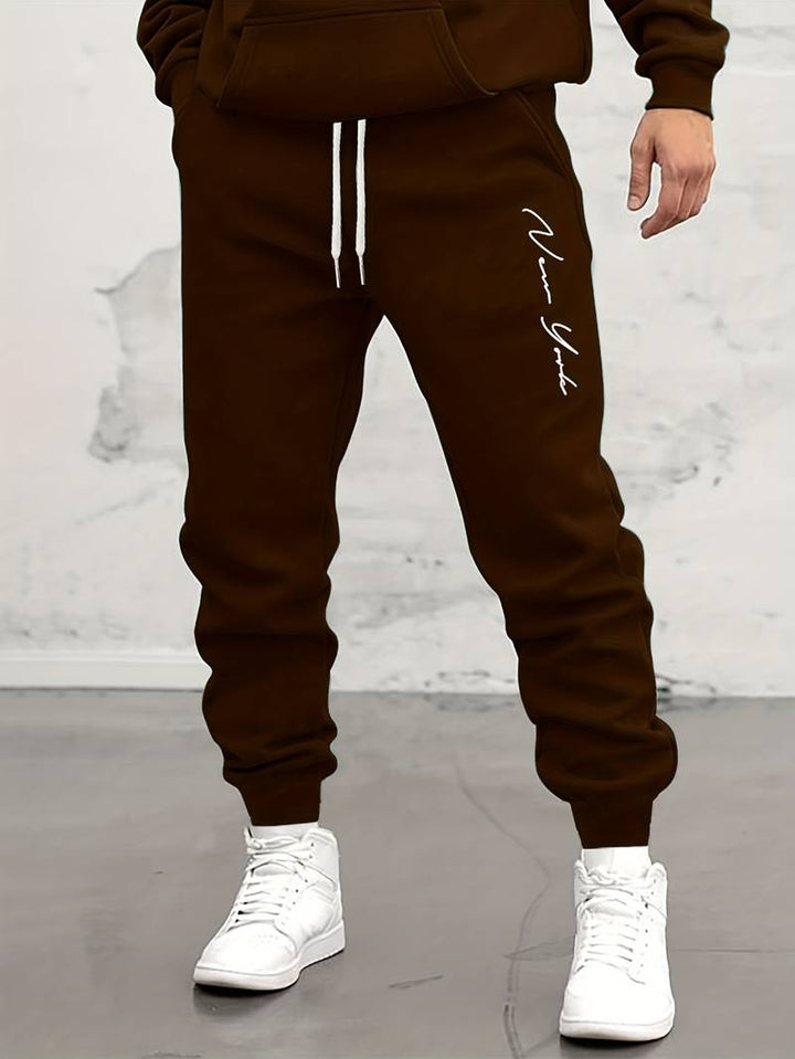 Herren Jogginghose mit Print – Sportliche Sweatpants mit Bündchen & Kordelzug