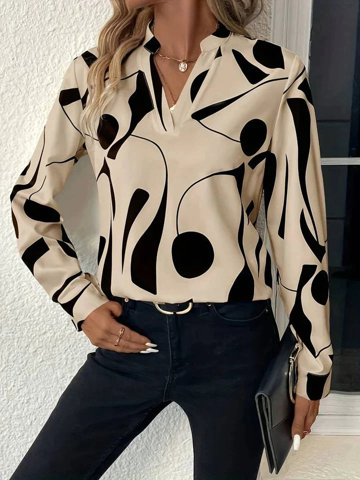 Elegante camicetta da donna con motivo astratto moderno e scollo a V