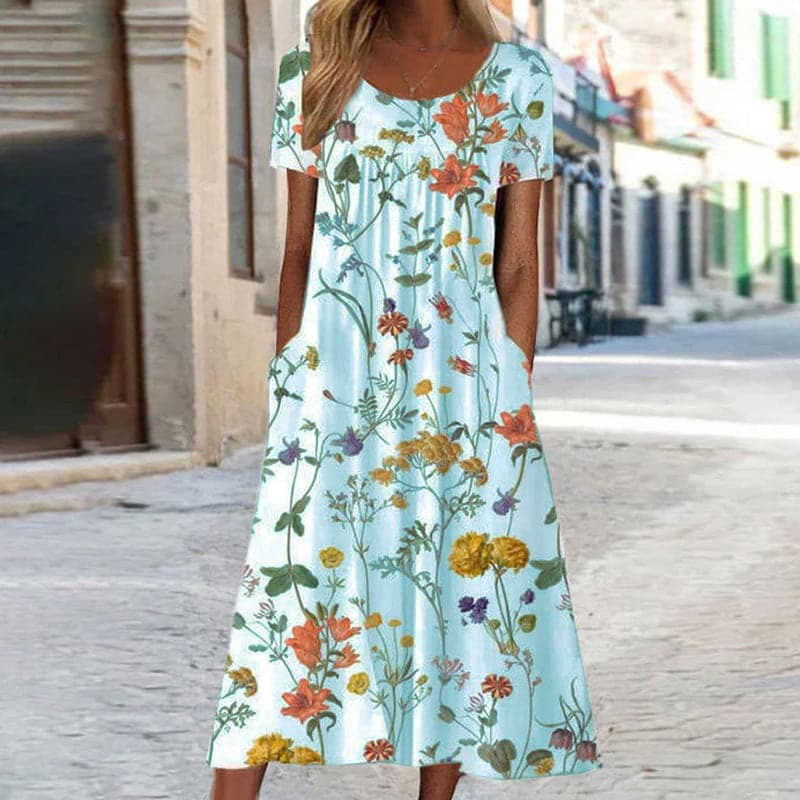 Robe Midi Élégance Fleurie – Une Symphonie de Fleurs et de Mode